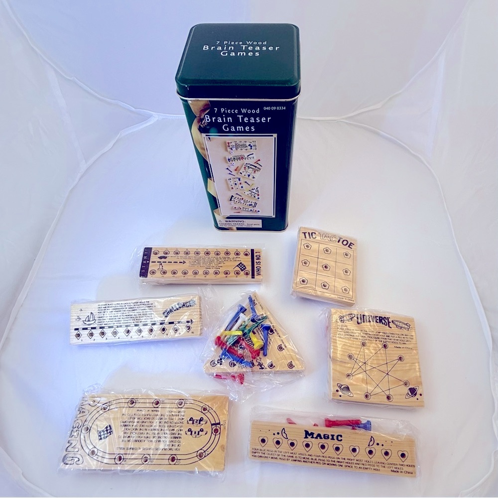 Brain Teasers - 7 Wooden Game Boards In Original Packaging And Metal Container